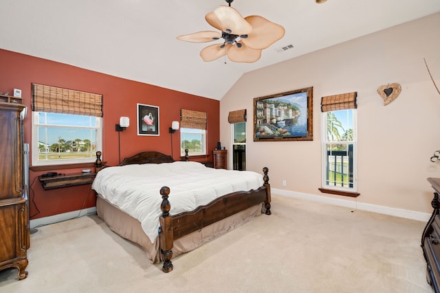 carpeted bedroom with ceiling fan and lofted ceiling