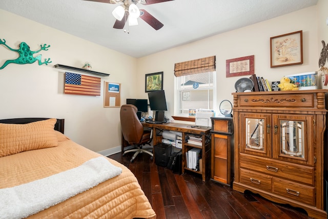 bedroom featuring ceiling fan and dark hardwood / wood-style flooring