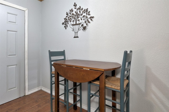 dining area featuring dark hardwood / wood-style flooring