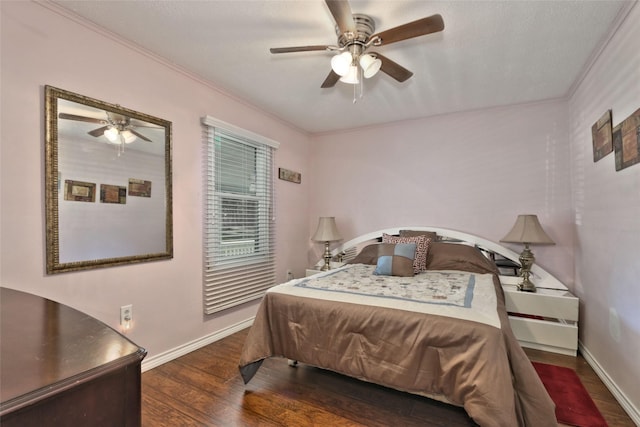 bedroom with ceiling fan, dark hardwood / wood-style flooring, and ornamental molding