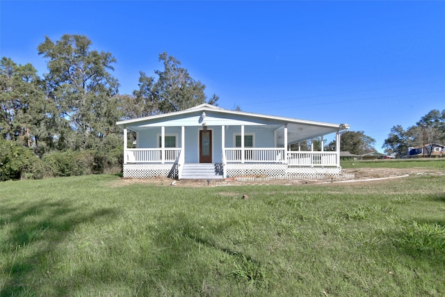 view of front facade with a front lawn and a porch