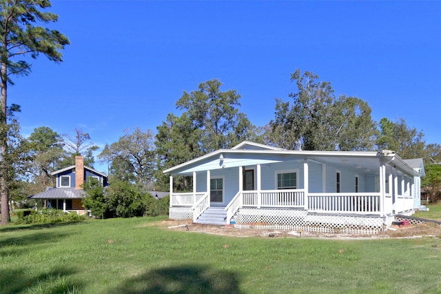 view of front of house with a porch and a front lawn