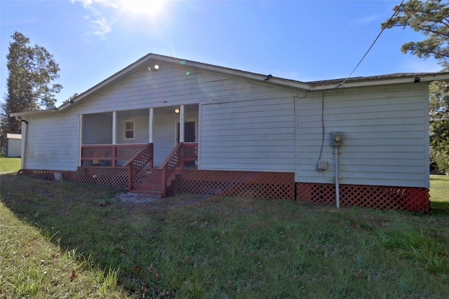 170 Mesa Verde, Livingston, TX 77351 - back of house with a lawn