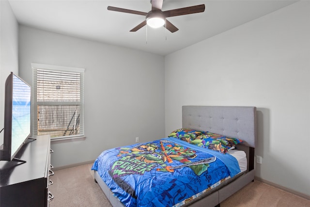 bedroom featuring light colored carpet and ceiling fan