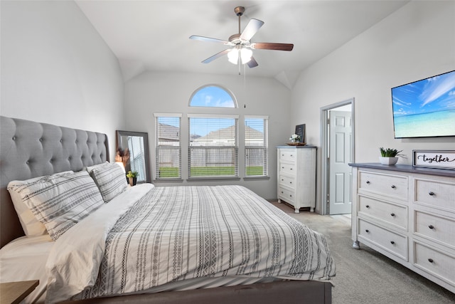 bedroom with light colored carpet, vaulted ceiling, and ceiling fan