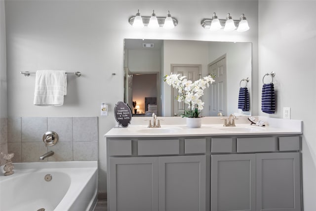 bathroom featuring vanity and a bathing tub