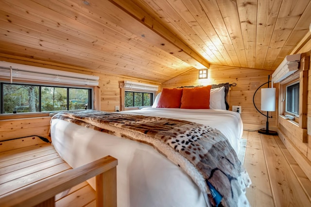 bedroom featuring hardwood / wood-style floors, vaulted ceiling with beams, wood walls, and wooden ceiling