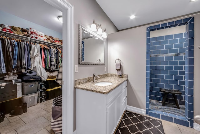 bathroom featuring tile patterned flooring and vanity