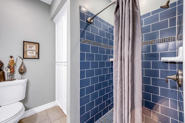 bathroom featuring curtained shower, tile patterned flooring, and toilet