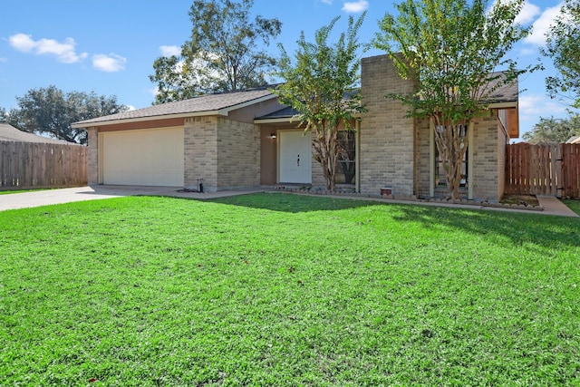 single story home featuring a front yard and a garage