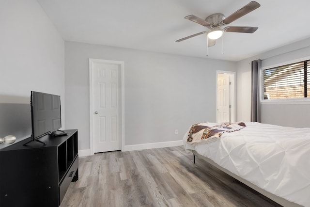 bedroom featuring light hardwood / wood-style flooring and ceiling fan