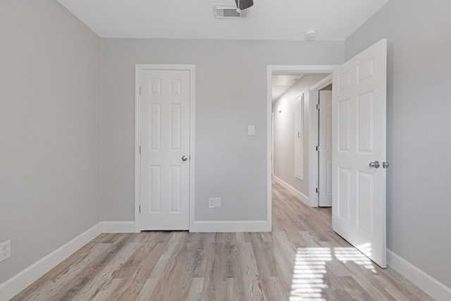 unfurnished bedroom featuring light hardwood / wood-style floors