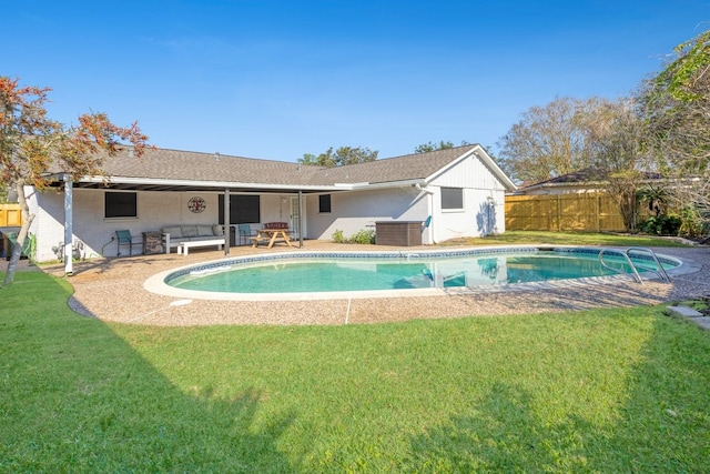 view of swimming pool with an outdoor living space, a yard, and a patio