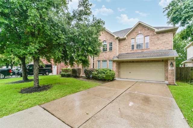 view of front of property with a garage and a front lawn