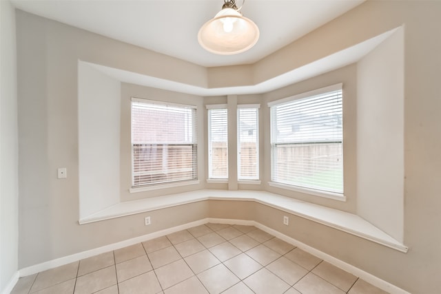 spare room with tile patterned floors