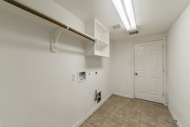 laundry area with electric dryer hookup, gas dryer hookup, light tile patterned floors, and hookup for a washing machine