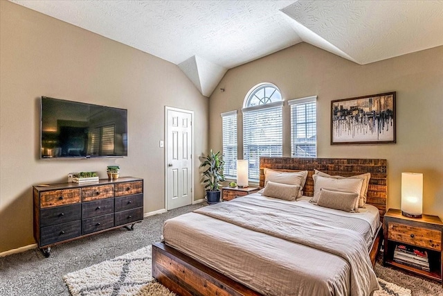 carpeted bedroom with baseboards, a textured ceiling, and vaulted ceiling