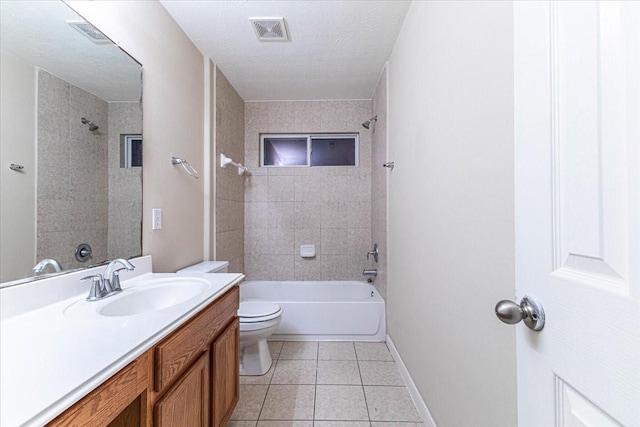 bathroom with tile patterned floors, toilet, a textured ceiling, bathing tub / shower combination, and vanity