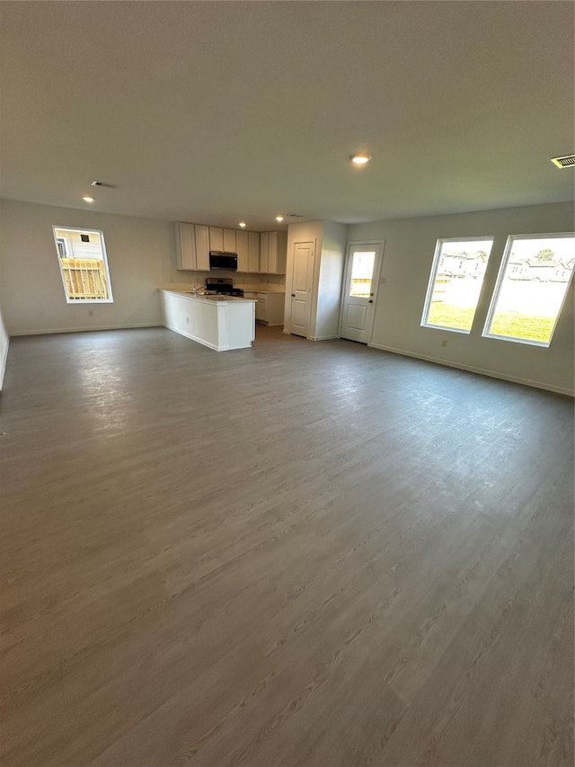 unfurnished living room featuring light hardwood / wood-style floors