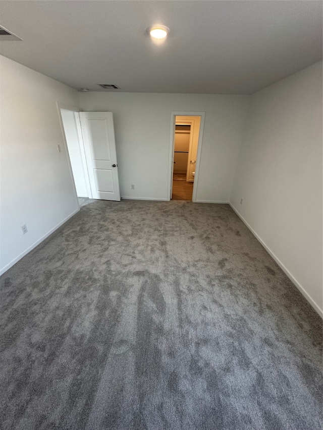 unfurnished bedroom with carpet