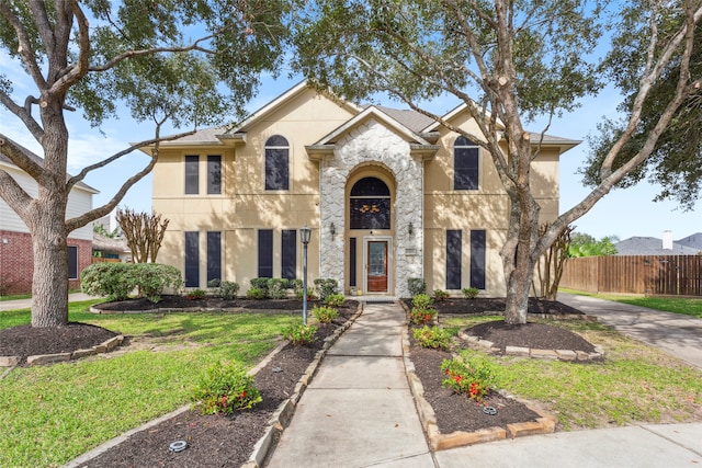 view of front of house with a front lawn