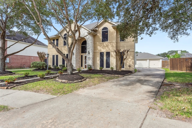 view of front of property featuring a garage and a front yard