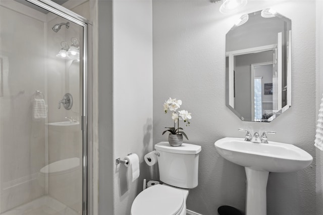 bathroom with walk in shower and toilet