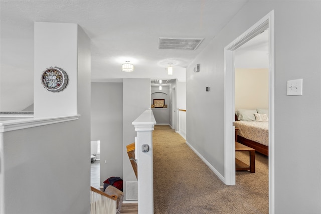 hallway featuring carpet