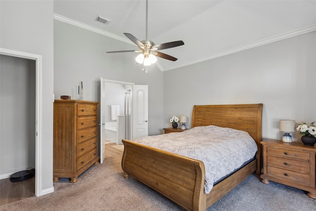 bedroom featuring carpet, vaulted ceiling, ceiling fan, crown molding, and connected bathroom