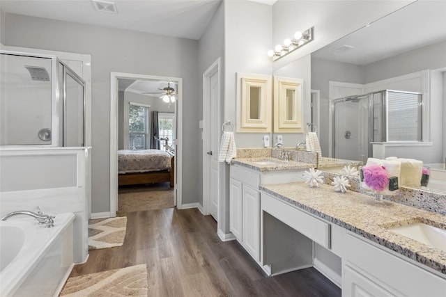 bathroom featuring separate shower and tub, ceiling fan, vanity, and wood-type flooring