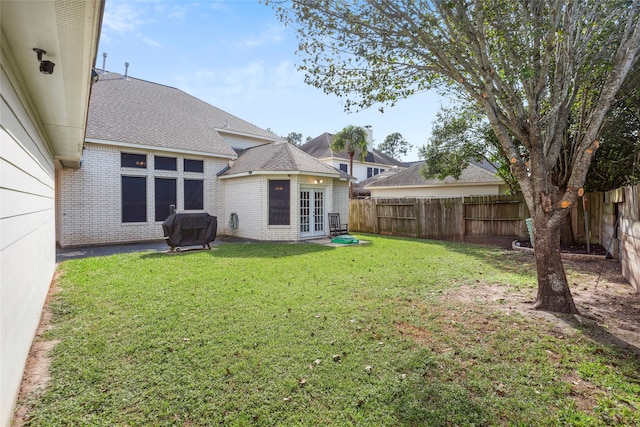 view of yard featuring french doors