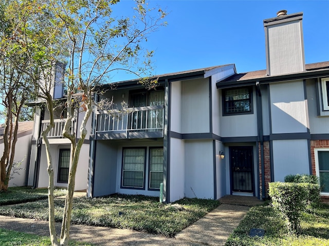 view of front of property with a balcony