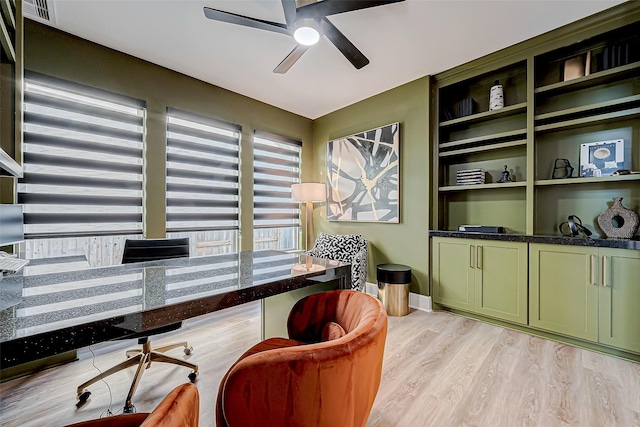 office space featuring ceiling fan and light hardwood / wood-style flooring