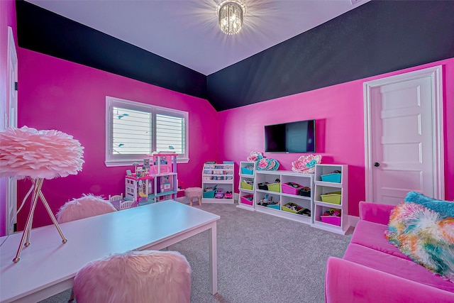 playroom featuring lofted ceiling and carpet