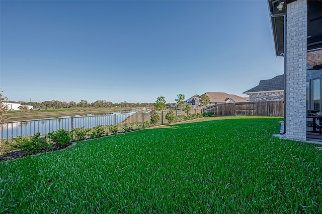 view of yard with a water view