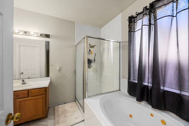 bathroom with vanity and separate shower and tub