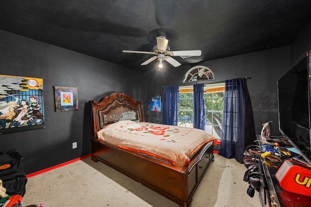 bedroom featuring ceiling fan and light carpet