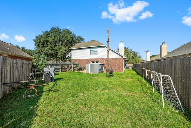 rear view of property with a lawn