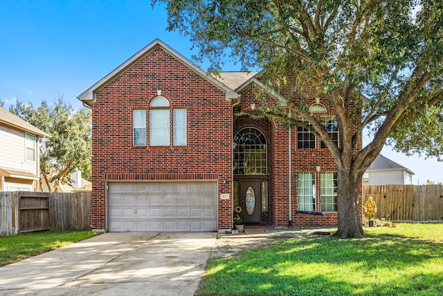 front facade featuring a front yard and a garage