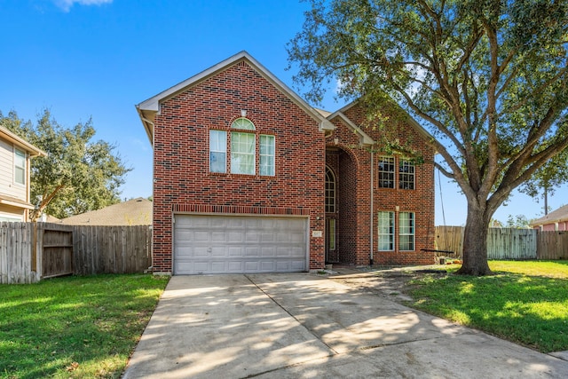 view of front of house with a garage and a front lawn