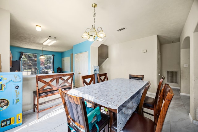 dining space featuring a chandelier