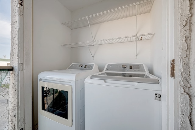 washroom with washer and clothes dryer