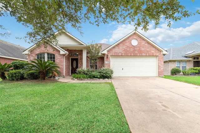 view of front of home featuring a front yard and a garage