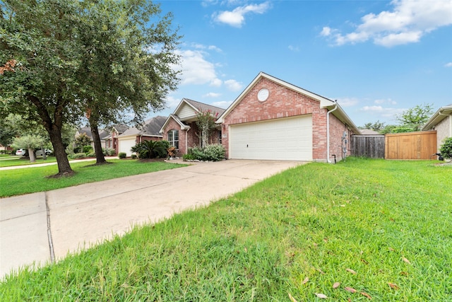 view of front of home with a front yard and a garage