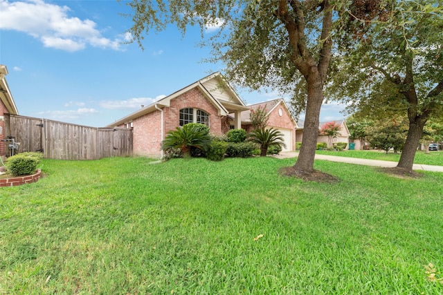 front facade featuring a front yard and a garage