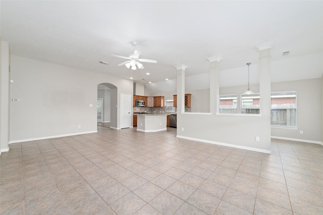 unfurnished living room featuring ceiling fan and light tile patterned floors