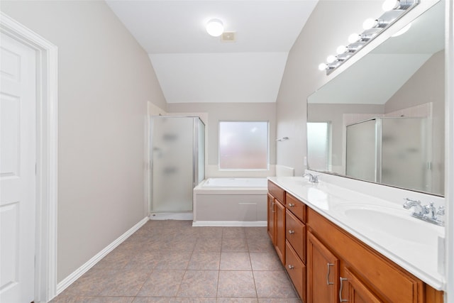 bathroom featuring tile patterned flooring, vanity, vaulted ceiling, and shower with separate bathtub