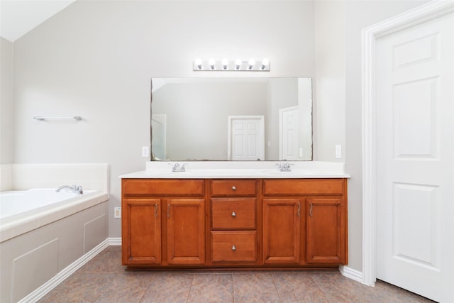 bathroom with tile patterned flooring, vanity, lofted ceiling, and a tub