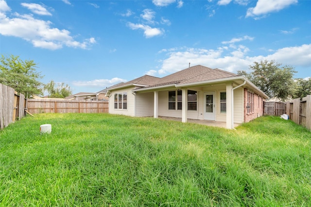 rear view of house with a patio