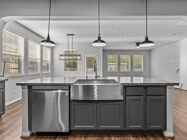 kitchen featuring dishwasher, ceiling fan, dark hardwood / wood-style flooring, and a wealth of natural light